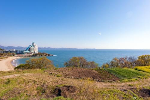 a view of the ocean from a hill at Buan Sonamuae Geolin Noeul Pension in Buan