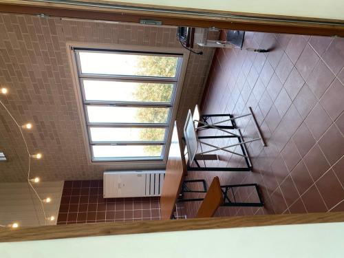 a view of a bathroom with a staircase and a window at Mijeok Gonggam and Soso Gonggam Dokchae Pool Villa in Yeongam