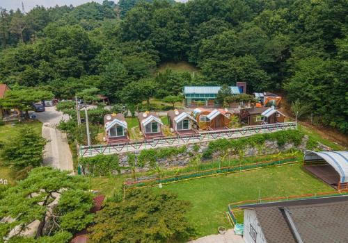 an aerial view of a house on a hill at Hana Soop Gwangwang Nongwon in Seocheon