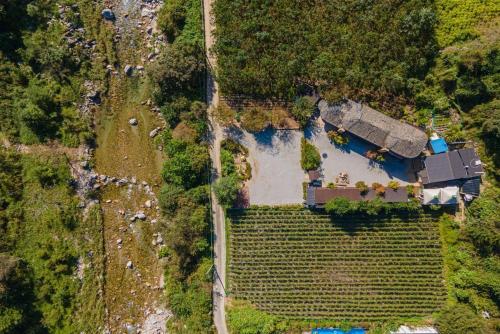 an aerial view of a house in a field at Kim Satgat Heukjib Yiyagi in Yeongwol