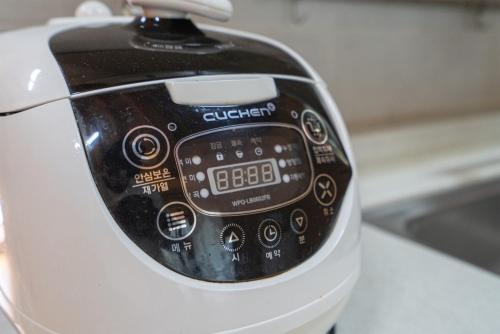 a close up of a cell phone sitting on a counter at Kim Satgat Heukjib Yiyagi in Yeongwol
