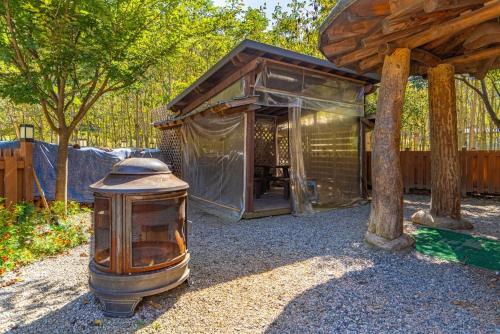 a large building with a tent in a yard at Kim Satgat Heukjib Yiyagi in Yeongwol