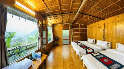 Postel nebo postele na pokoji v ubytování H'Mong Cát Cát Homestay