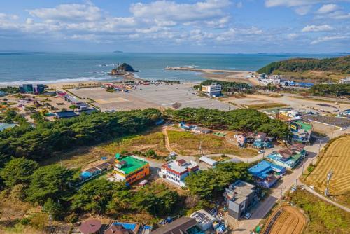 an aerial view of a town next to the ocean at Trust Pension Taean in Taean