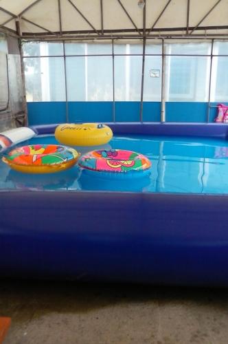 two inflatable trampols on top of a swimming pool at Trust Pension Taean in Taean