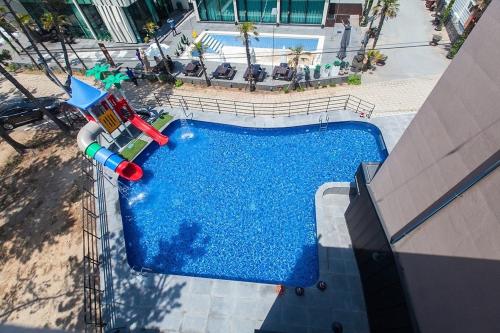 an overhead view of a swimming pool with a water slide at Ireland in Wando