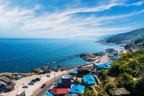an aerial view of a town next to the ocean at Yeongdeok Stay 693 in Yeongdeok