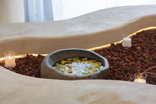 a tray of food with candles and nuts at Gangneung muton roll in Yŏngjin 2-ri