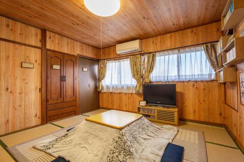 Cama o camas de una habitación en Asahi
