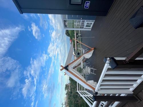a view of the sky from a building with stairs at Mazihouse in Mukho-dong