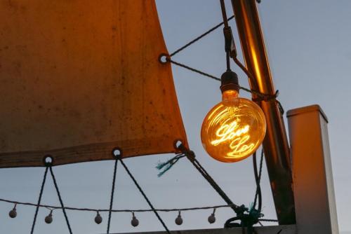a light bulb hanging from a pole at Suncheon Slow Pension in Suncheon