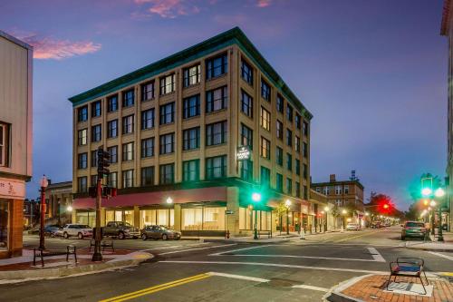 a large building on a city street at night at New Bedford Harbor Hotel, an Ascend Collection Hotel in New Bedford