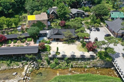 a model of a house with a garden at Saint in Udumji Pool Villa in Sanjeong-ri