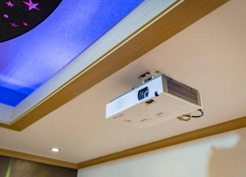 a tv on the ceiling of a room at Daebudo Siesta Pension in Ansan