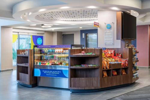 a grocery store with several shelves of food at Tru By Hilton Cali Sur in Cali