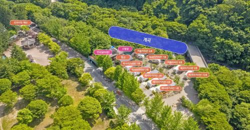 an aerial view of a resort in the middle of a forest at Muju camping Caravan in Samgong