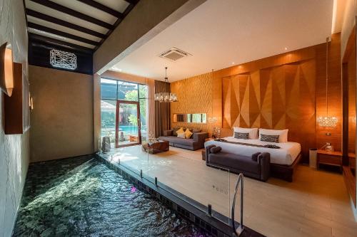Giường trong phòng chung tại La Miniera Pool Villas Pattaya - Small Luxury Hotels of the World
