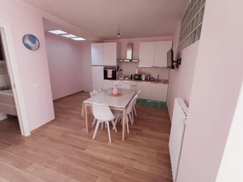 a kitchen and dining room with a table and chairs at Villa MARGHERITA in Pratola Peligna