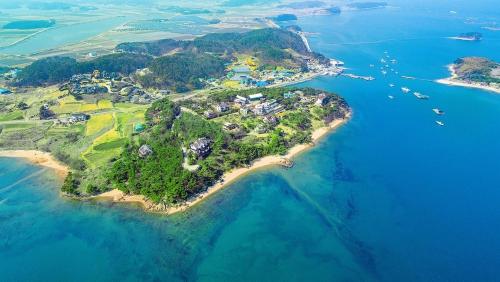 an aerial view of an island in the water at Badasol Fragrance Pension in Taean