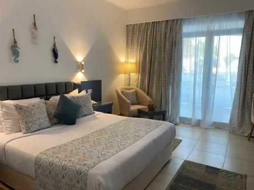 Una cama o camas en una habitación de Sharm Reef Hotel