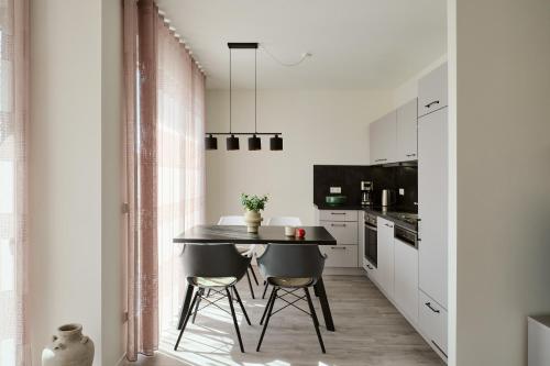 Una cocina o cocineta en Apartment C9 mit überdachtem Balkon & Nutzung der Wellness- & Aktivbereiche im "Pine Hill Resort"