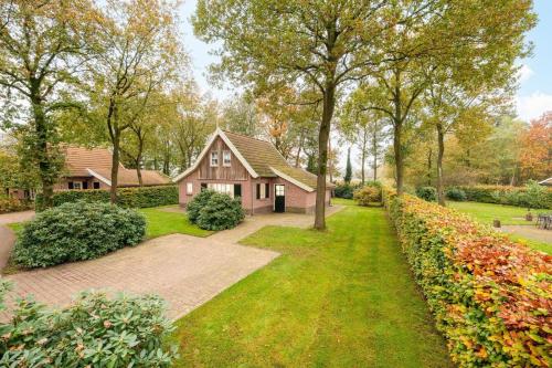 a home with a pathway leading to a house at Buitengoed het Lageveld 55 in Hoge-Hexel