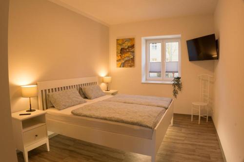 Ένα ή περισσότερα κρεβάτια σε δωμάτιο στο Ferienwohnung Kolow