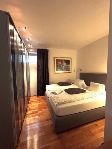 a hotel room with two beds and a balcony at Aparthotel Pfeffermühle in Ramsau am Dachstein