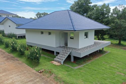 a rendering of a house with a blue roof at Corsita Resort Koh Mak in Ko Mak