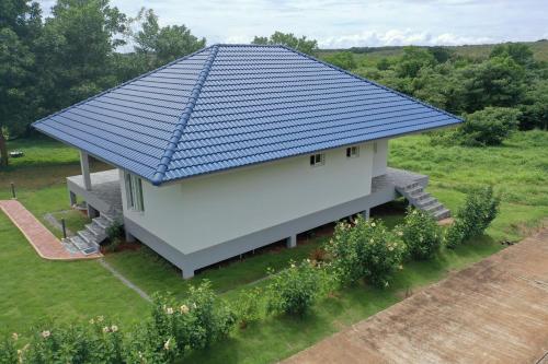 an overhead view of a house with a blue roof at Corsita Resort Koh Mak in Ko Mak