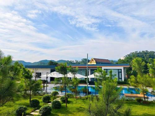 an image of a resort with a swimming pool at OLALA Villa & Homestay Bungalow in Hanoi