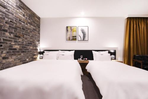 Кровать или кровати в номере XYM Hotel Mundeok
