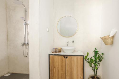 a bathroom with a sink and a mirror at Zanzibari holiday home by Liv Zanzibar in Paje