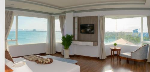 a living room with a view of the ocean at Saigon - Ninh Chu Hotel & Resort in Phan Rang
