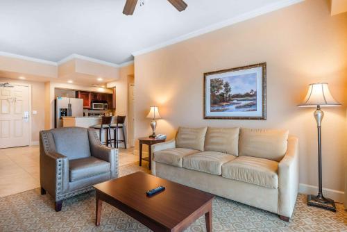 a living room with a couch and a chair at Bluegreen Vacations Fountains, an Ascend Collection Resort in Orlando