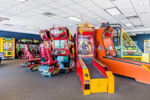 a row of arcade games in a room at Bluegreen Vacations Fountains, an Ascend Collection Resort in Orlando
