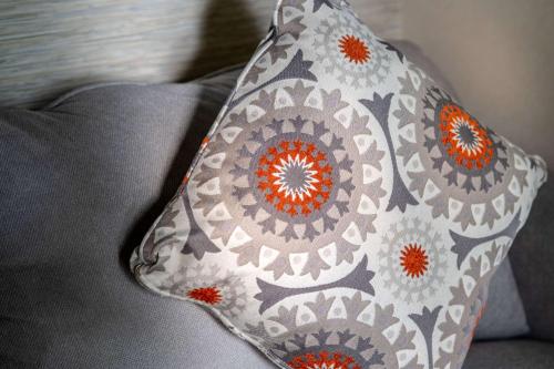 a pillow sitting on top of a couch at Edgar Hotel Martha's Vineyard, an Ascend Collection Hotel in Edgartown