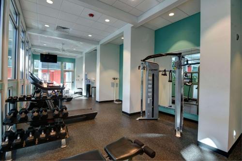 a gym with cardio equipment in a building at Oasis Hotel and Conv Center, an Ascend Collection Hotel in Springfield