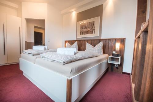Postel nebo postele na pokoji v ubytování Hotel Nige Hus