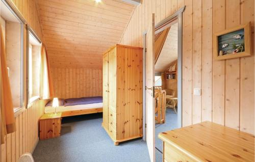 a small room with a bed and a window at Nice Home In Rechlin With Wifi in Rechlin