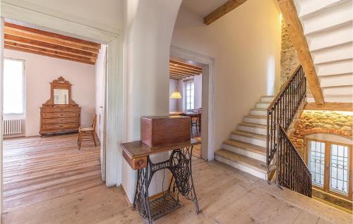 a living room with a staircase and a wooden floor at Casa Giu in Pacengo di Lazise