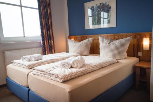 Postel nebo postele na pokoji v ubytování Hotel Nige Hus