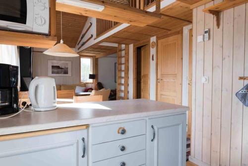 a kitchen with a white counter top in a house at Sauna | Terrace | Engine heater | Pets allowed in Lofsdalen