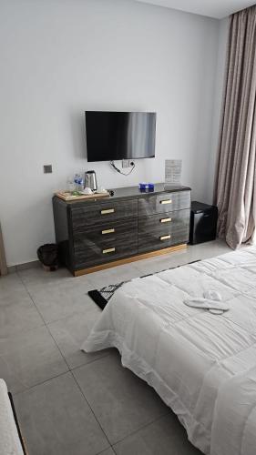 Llit o llits en una habitació de Villa IROKO