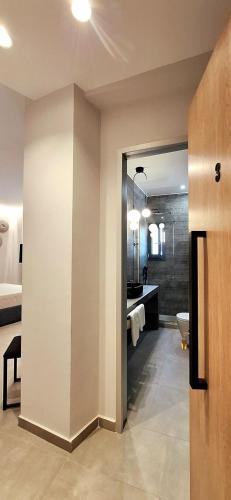 a bathroom with a sink and a toilet in a room at K35 Apartments in Preveza