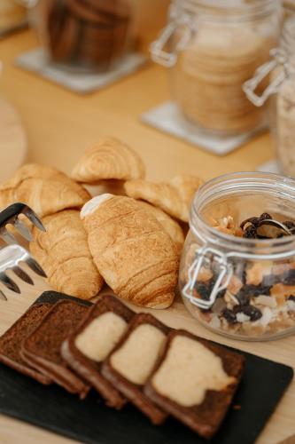 a table topped with bread and a plate of food at Emblemático F24-Only Adults B&B in Santa Cruz de Tenerife