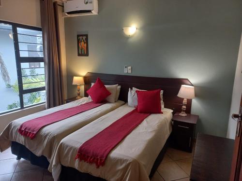 Ένα ή περισσότερα κρεβάτια σε δωμάτιο στο Shonalanga Lodge