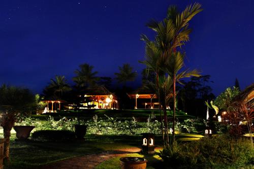 a house at night with lights in the yard at Bagus Jati Health & Wellbeing Retreat in Tegalalang