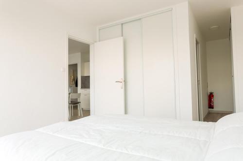 Ένα ή περισσότερα κρεβάτια σε δωμάτιο στο Appartement pour 4 avec vue sur mer, Benodet