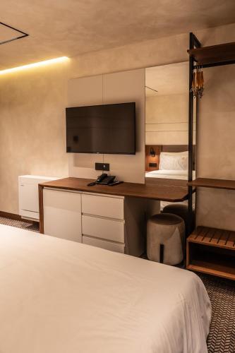 Postel nebo postele na pokoji v ubytování Mattis Hotel